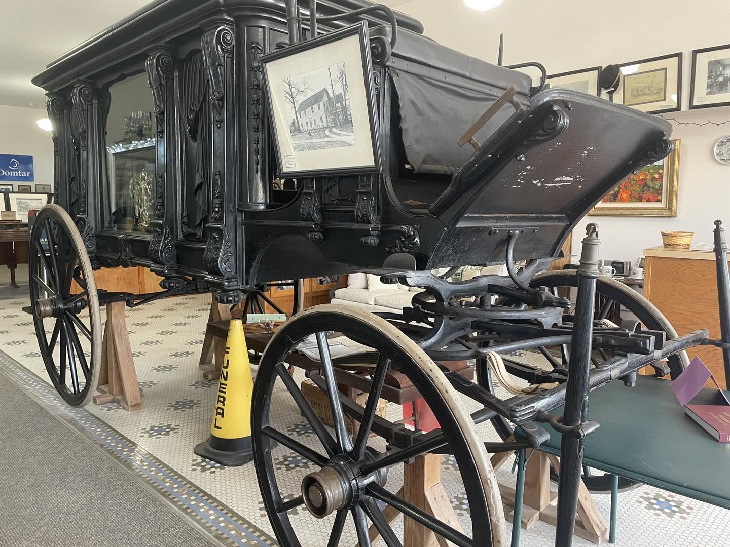Authentic photograph of a historic carriage inside the museum